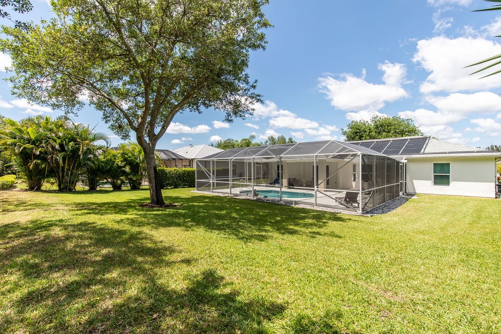 3673 2nd Place Southwest Vero Beach, FL 32968 - Photo 6 of 33 a view of a house with a big yard