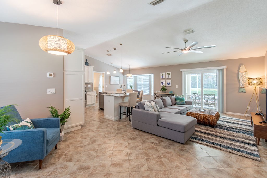 3673 2nd Place Southwest Vero Beach, FL 32968 - Photo 7 of 33 a living room with furniture potted plant and a chandelier