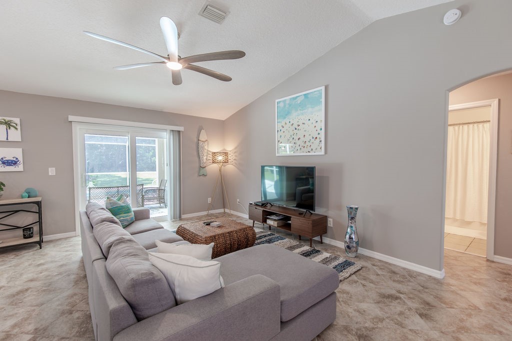 3673 2nd Place Southwest Vero Beach, FL 32968 - Photo 10 of 33 a living room with furniture window and a ceiling fan