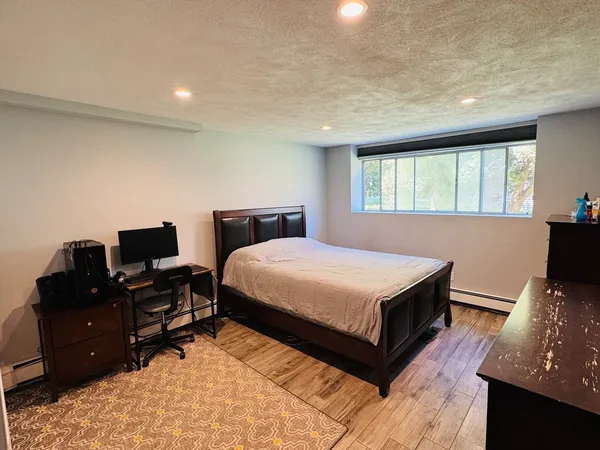 a bedroom with a bed and window