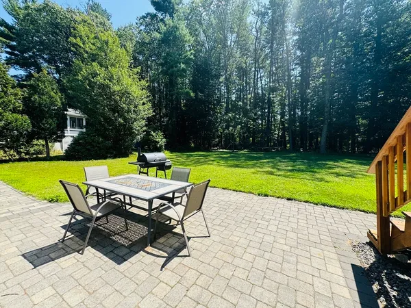 a view of a swimming pool with an outdoor space and seating area