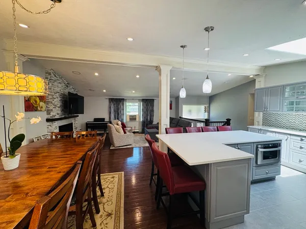 a large kitchen with a table and chairs