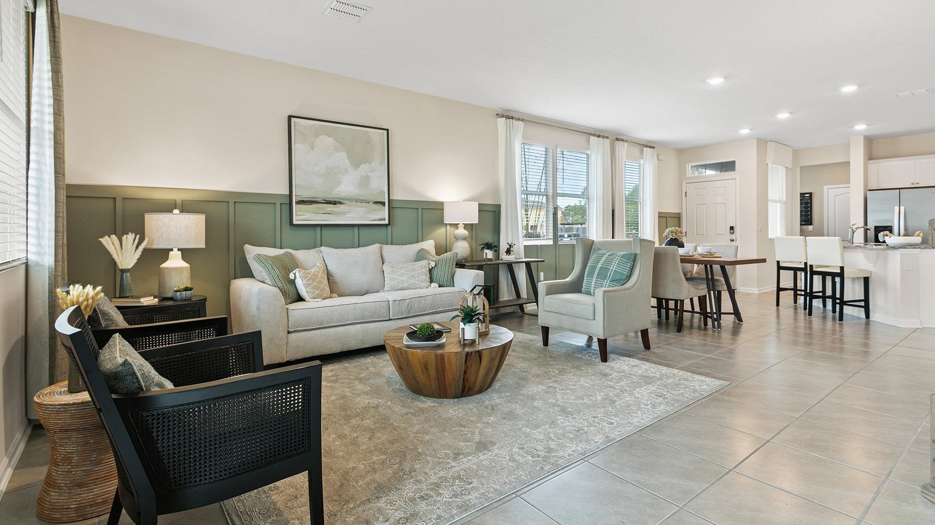 315 Redbud Road Palm Coast, FL 32137 - Photo 12 of 39 a living room with furniture a rug and a chandelier