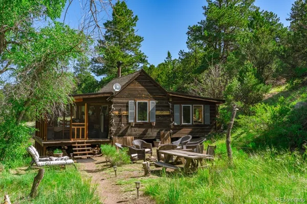 a backyard of a house with yard barbeque oven and outdoor seating