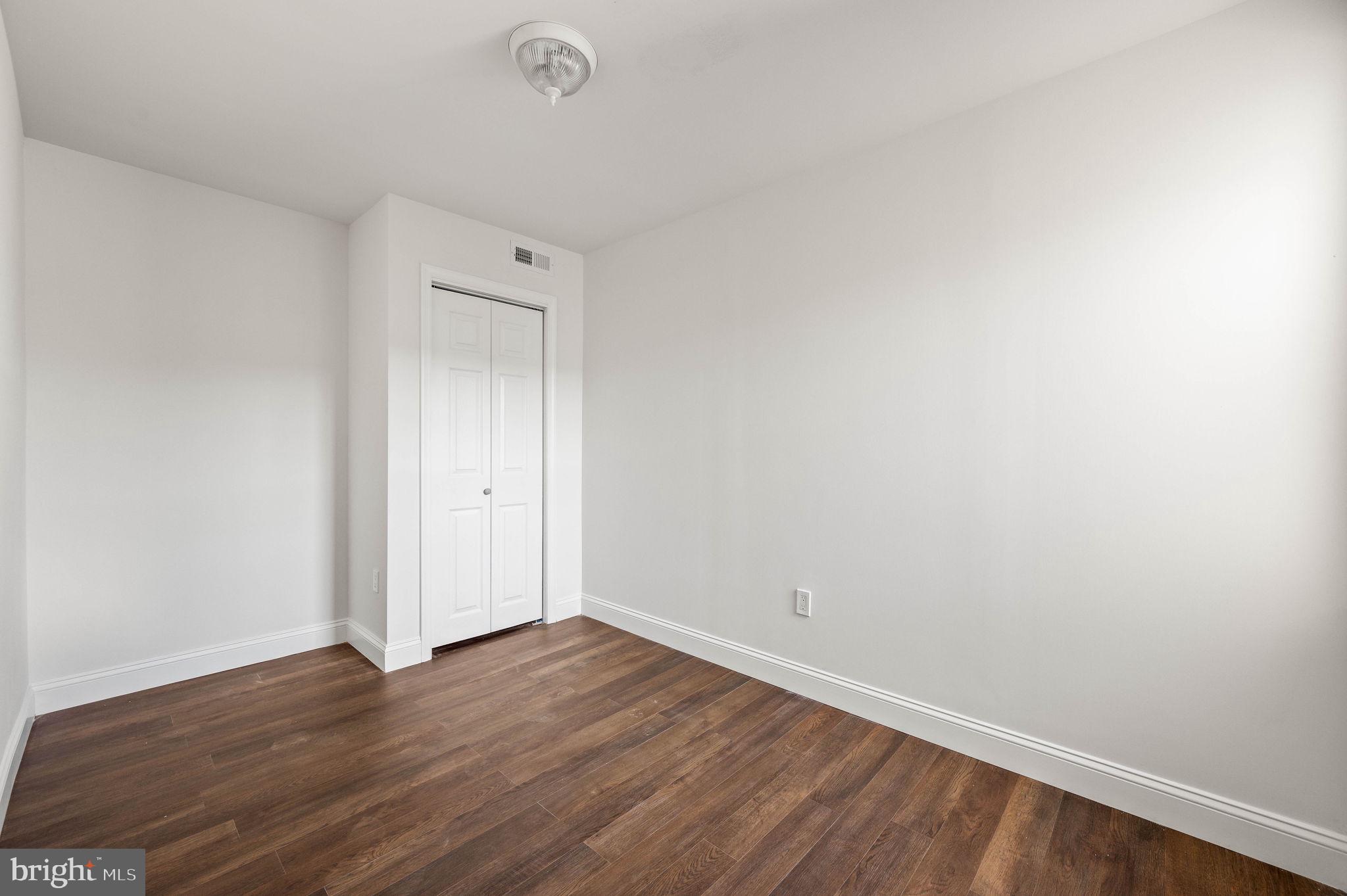 1852 East Lippincott Street Philadelphia, PA 19134 - Photo 17 of 25 a view of an empty room with wooden floor