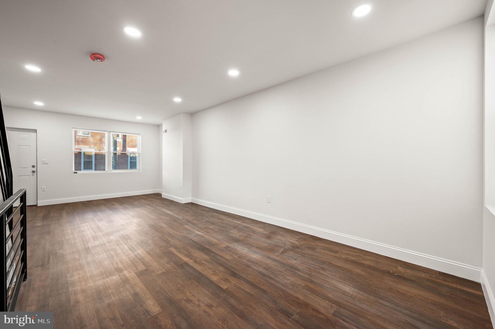 1852 East Lippincott Street Philadelphia, PA 19134 - Photo 19 of 25 an empty room with wooden floor and windows