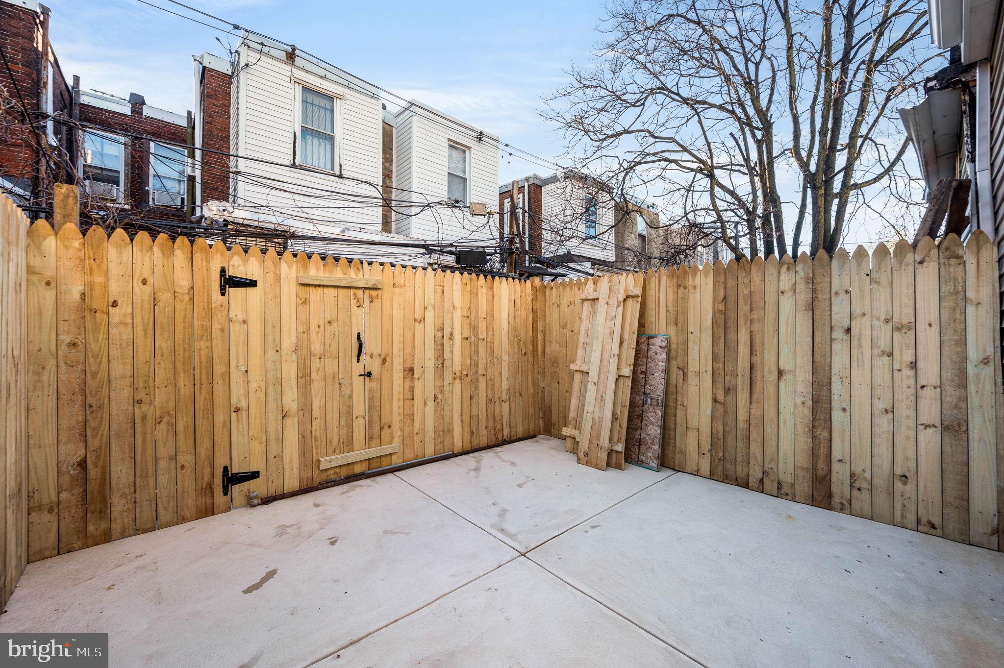 1852 East Lippincott Street Philadelphia, PA 19134 - Photo 25 of 25 a view of a house with a wooden fence