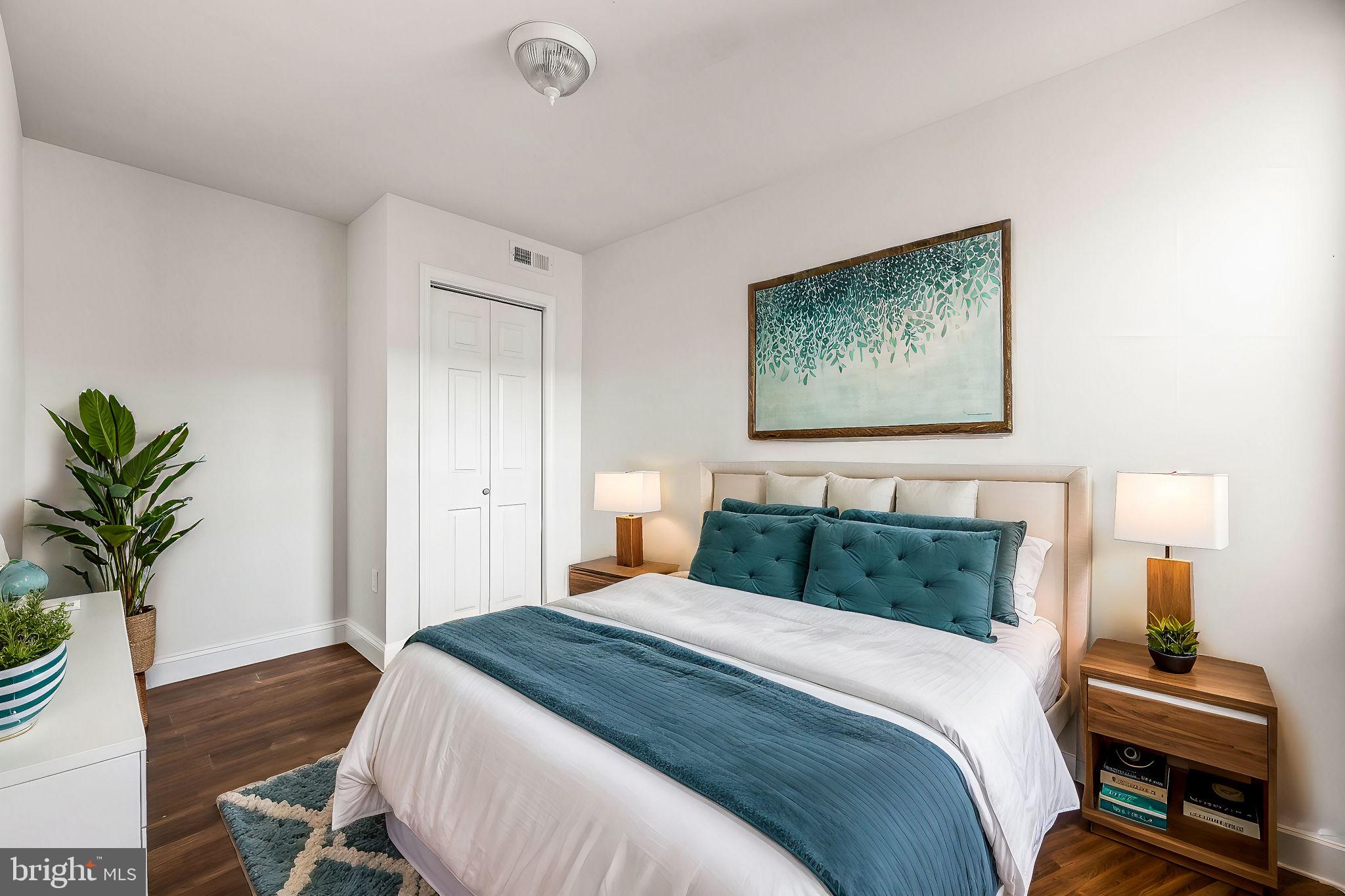 1852 East Lippincott Street Philadelphia, PA 19134 - Photo 8 of 25 a bedroom with a bed and a potted plant