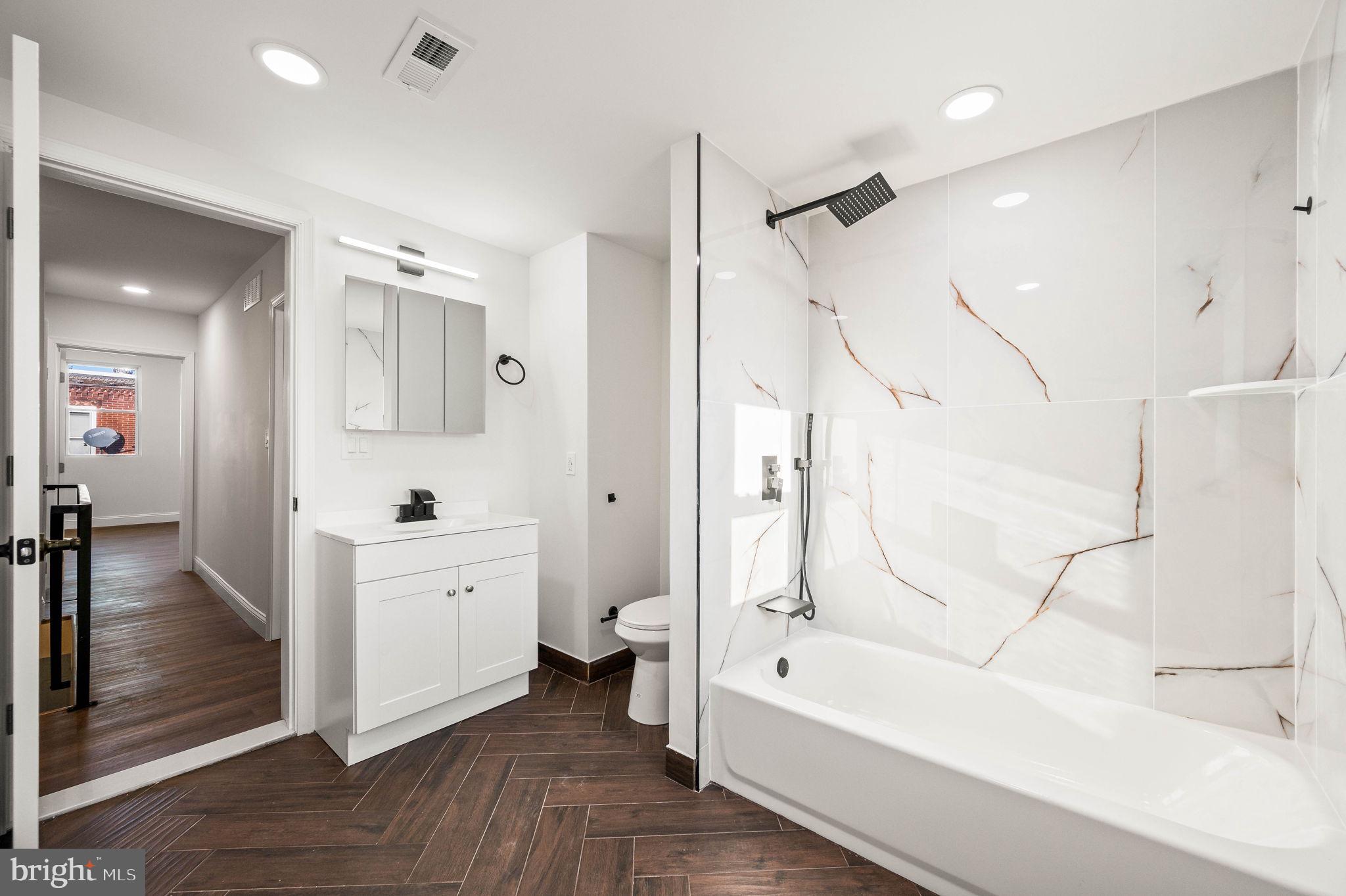 1852 East Lippincott Street Philadelphia, PA 19134 - Photo 10 of 25 a bathroom with a bathtub a toilet and a shower