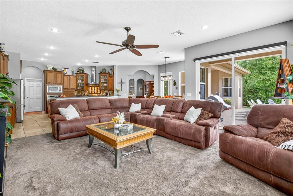13887 Gavin Road Dover, FL 33527 - Photo 26 of 74 a living room with furniture and a large window