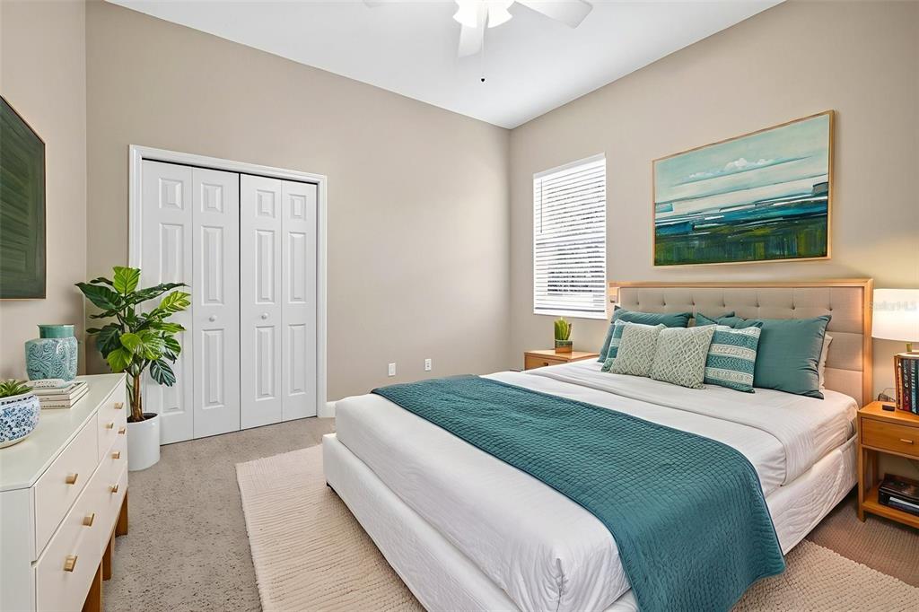 13887 Gavin Road Dover, FL 33527 - Photo 41 of 74 a bedroom with a bed potted plant with the wooden floor