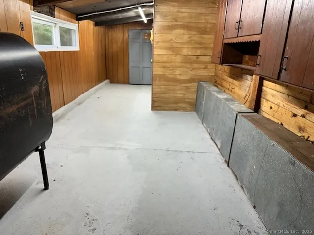 a view of an empty room and wooden floor