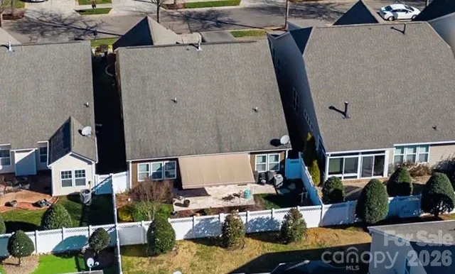 an aerial view of houses with outdoor seating