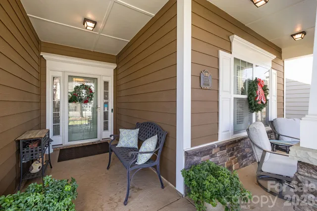 a porch with outdoor seating