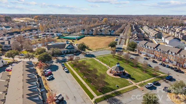 an aerial view of a house with outdoor space