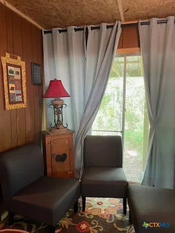 a balcony with furniture and a window