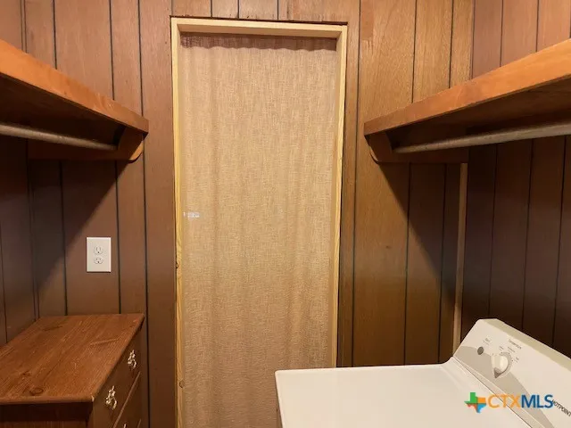 a bathroom with a shower curtain and a sink