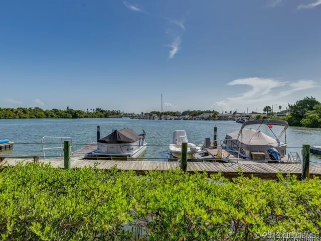 a view of a lake with outdoor seating and lake view