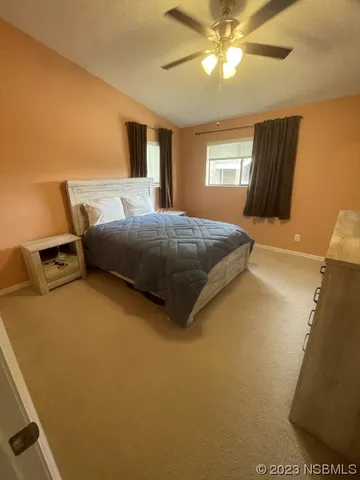 a bedroom with bed and window