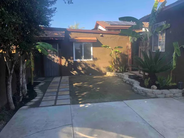 a view of a house with a street