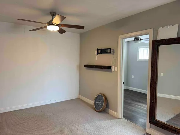 a view of a livingroom and a bathroom