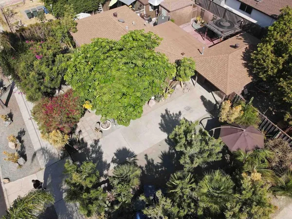 an aerial view of a house with a yard and a garden