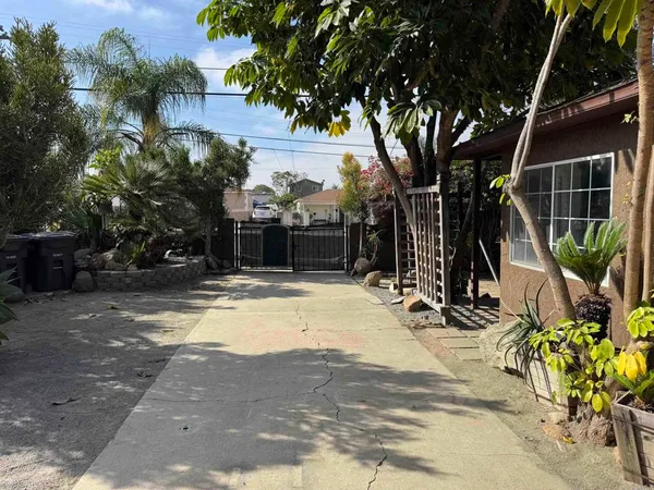 a view of a house with basketball court