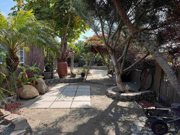 a view of a backyard with sitting area