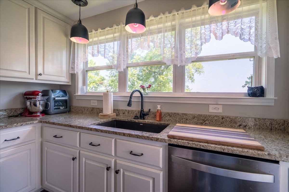 460 Ables Lane Pulaski, TN 38478 - Photo 11 of 23 a kitchen with granite countertop a sink and a window