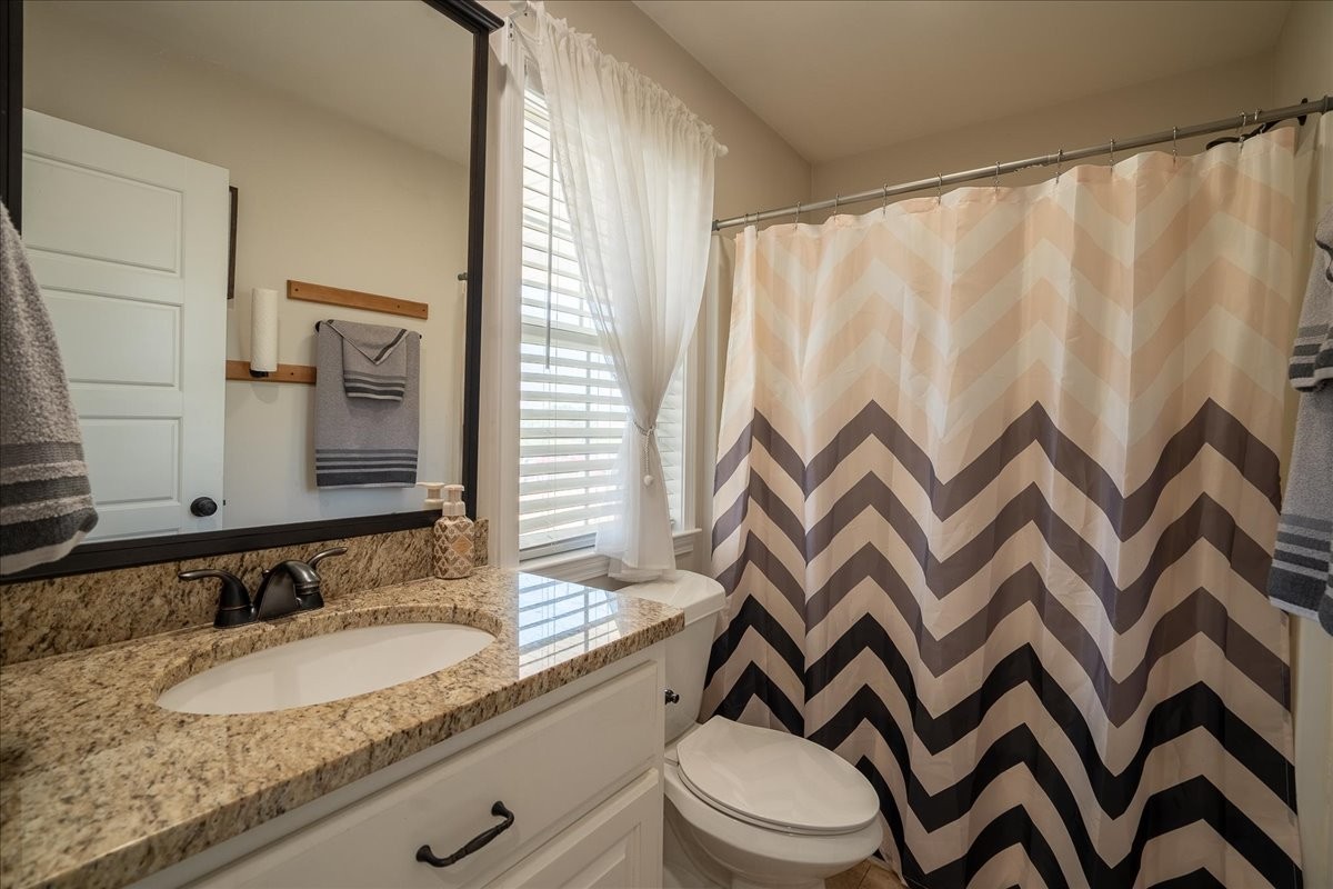 460 Ables Lane Pulaski, TN 38478 - Photo 14 of 23 a bathroom with a granite countertop sink and a mirror
