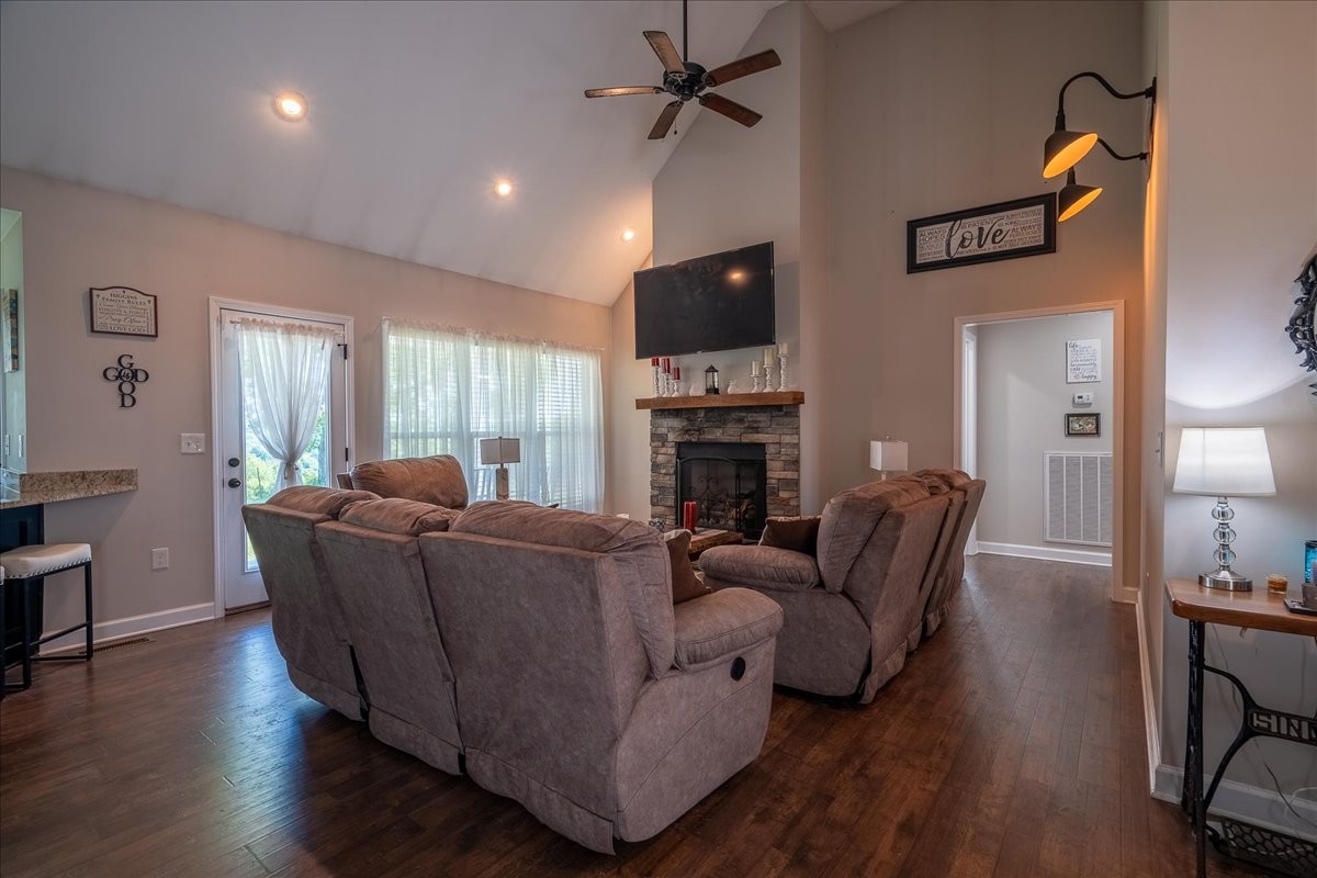 460 Ables Lane Pulaski, TN 38478 - Photo 16 of 23 a living room with furniture a fireplace and a flat screen tv