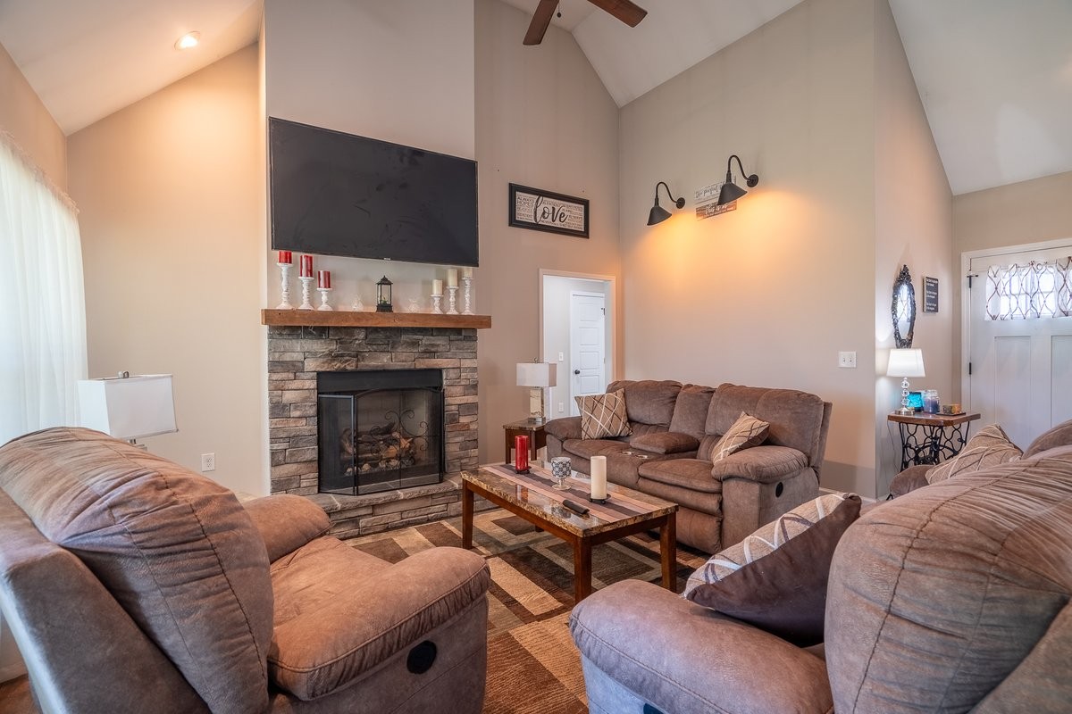 460 Ables Lane Pulaski, TN 38478 - Photo 17 of 23 a living room with furniture a flat screen tv and a fireplace