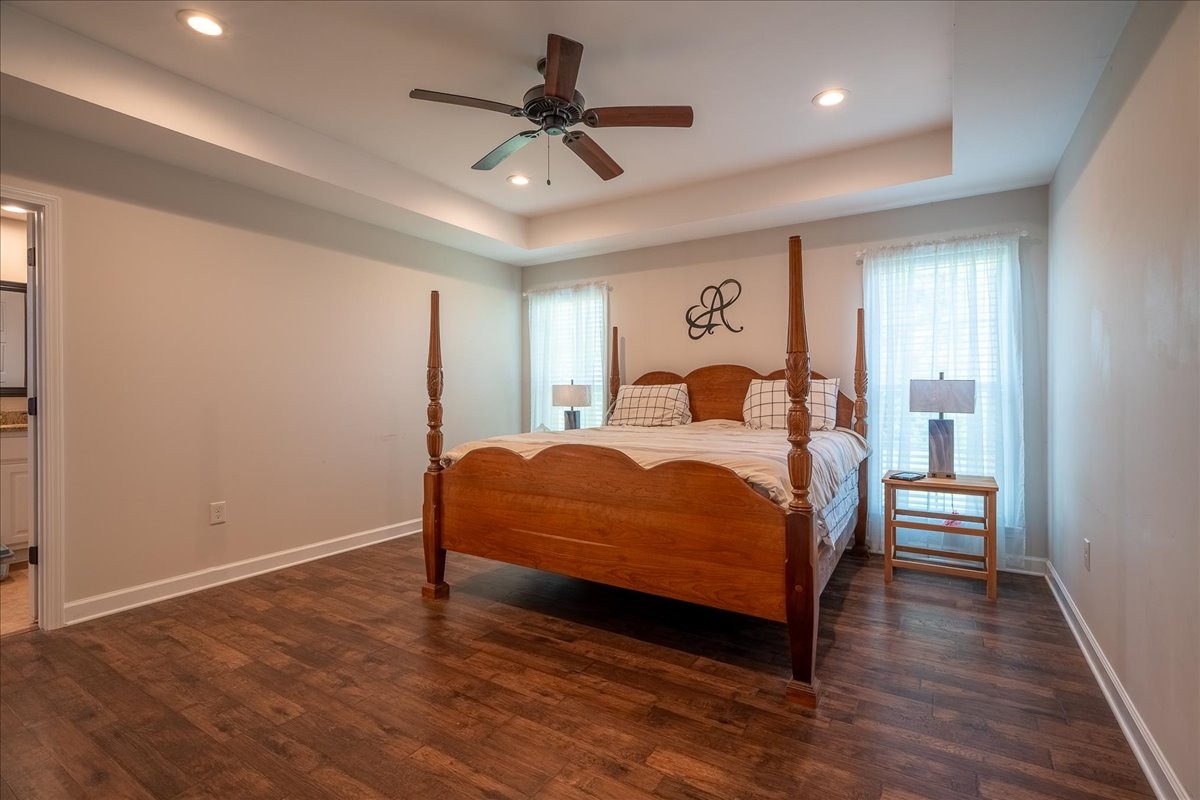 460 Ables Lane Pulaski, TN 38478 - Photo 19 of 23 a bedroom with a bed chandelier and a window
