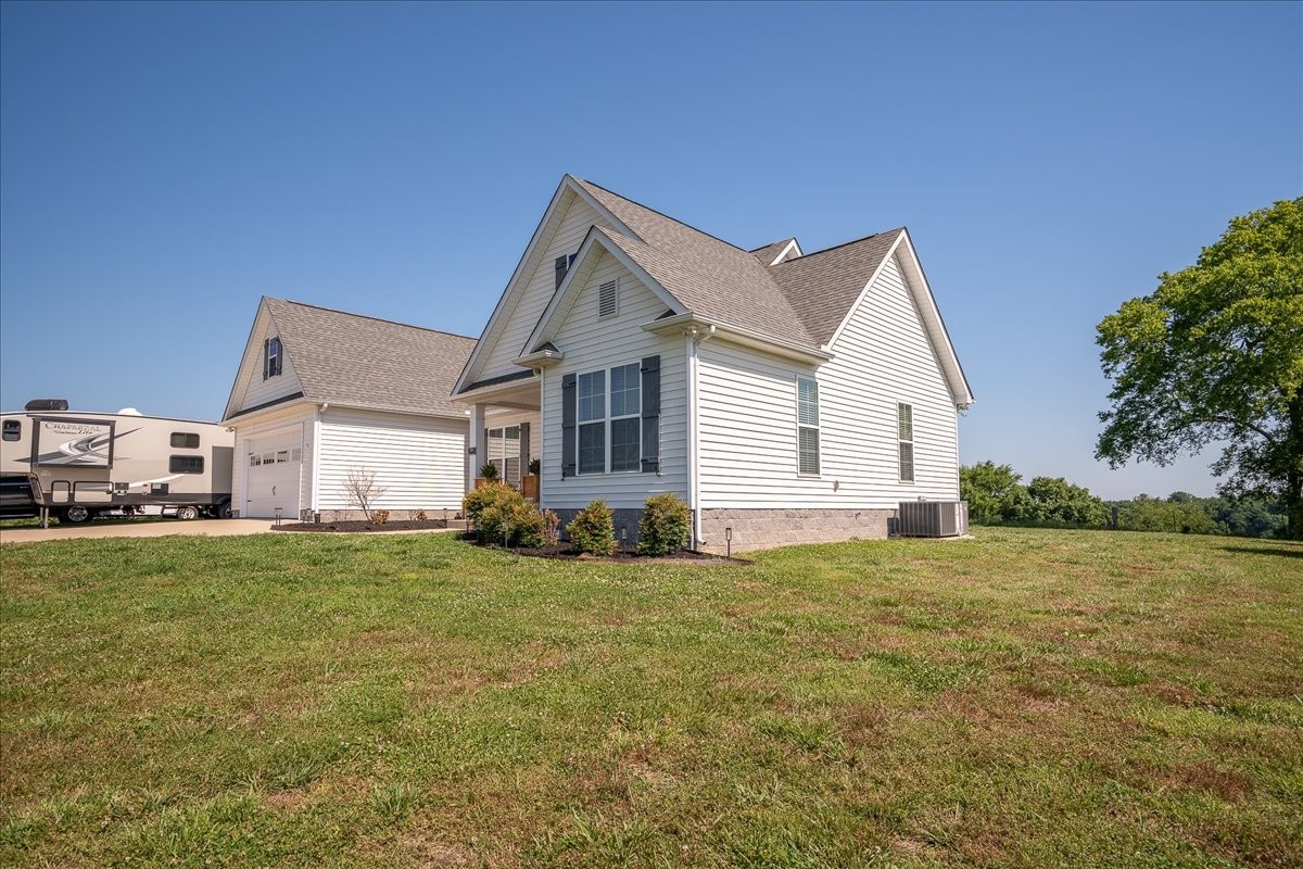 460 Ables Lane Pulaski, TN 38478 - Photo 2 of 23 a view of a house with a yard and garage