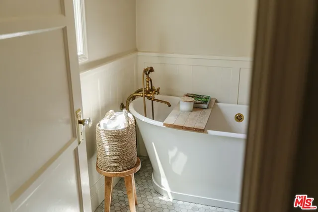 a bathroom with a sink and mirror