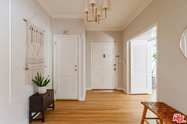 a view of a livingroom with wooden floor and chair
