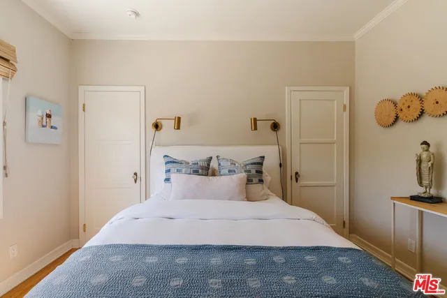 a bedroom with a bed and a couch