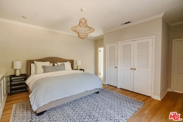 a bedroom with bed and a window