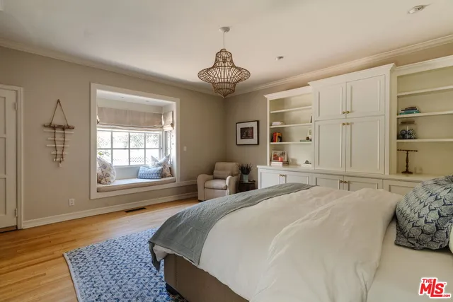 a bathroom with a white tub and a window