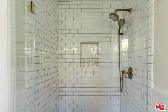 a view of balcony with table and chairs and wooden fence