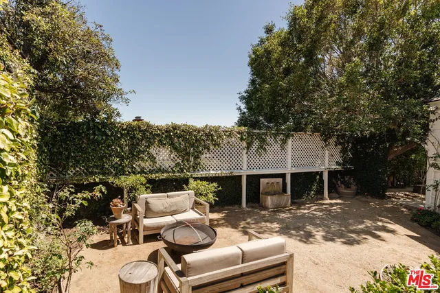 a view of a yard covered in snow