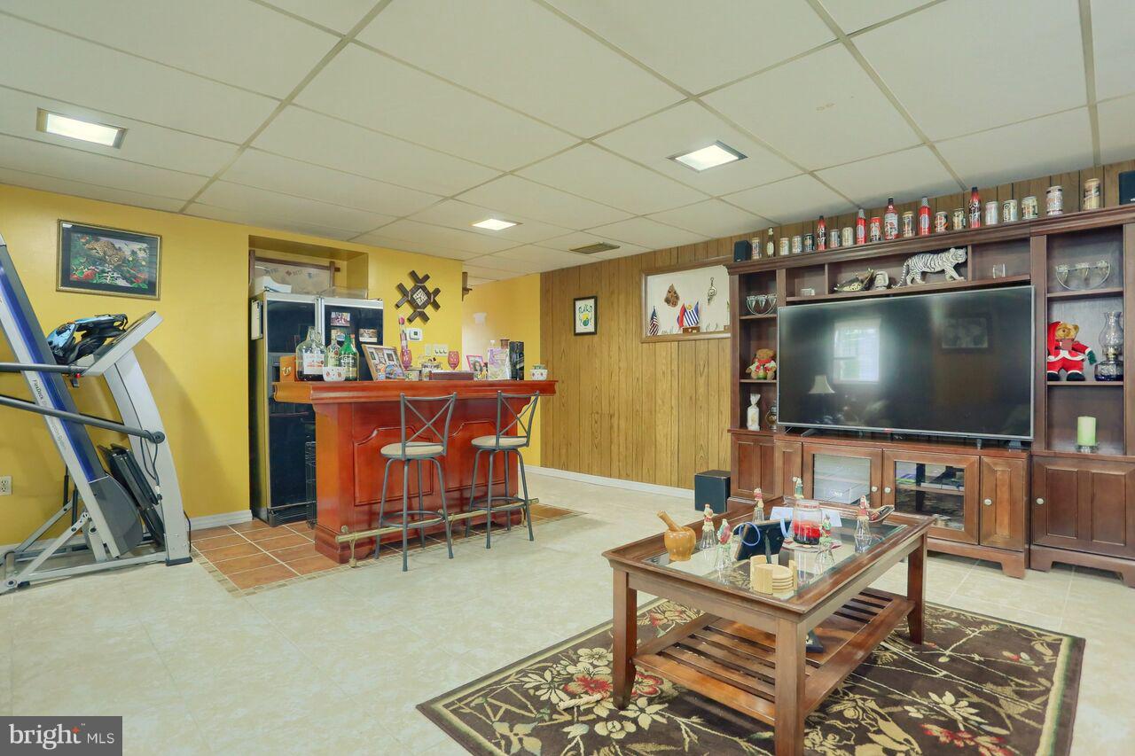5213 Mohaue Road Temple, PA 19560 - Photo 4 of 26 Living room with media center and bar