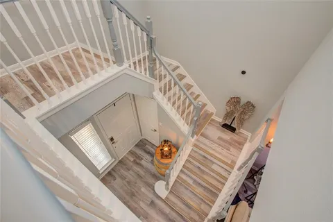 a view of staircase with white walls