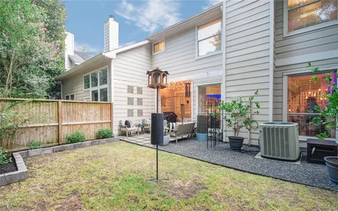 a backyard of a house with seating space