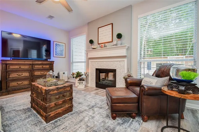 a living room with furniture and a fireplace