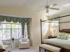 a bedroom with a bed and a couch