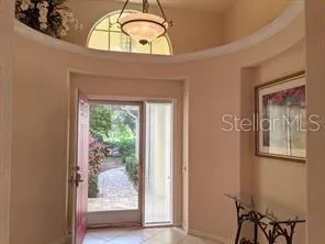 a view of a livingroom with furniture and a window