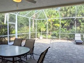 a view of a living room and floor to ceiling window in an empty room