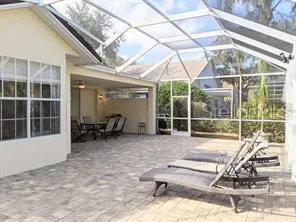 a view of a room with gym equipment and floor to ceiling window
