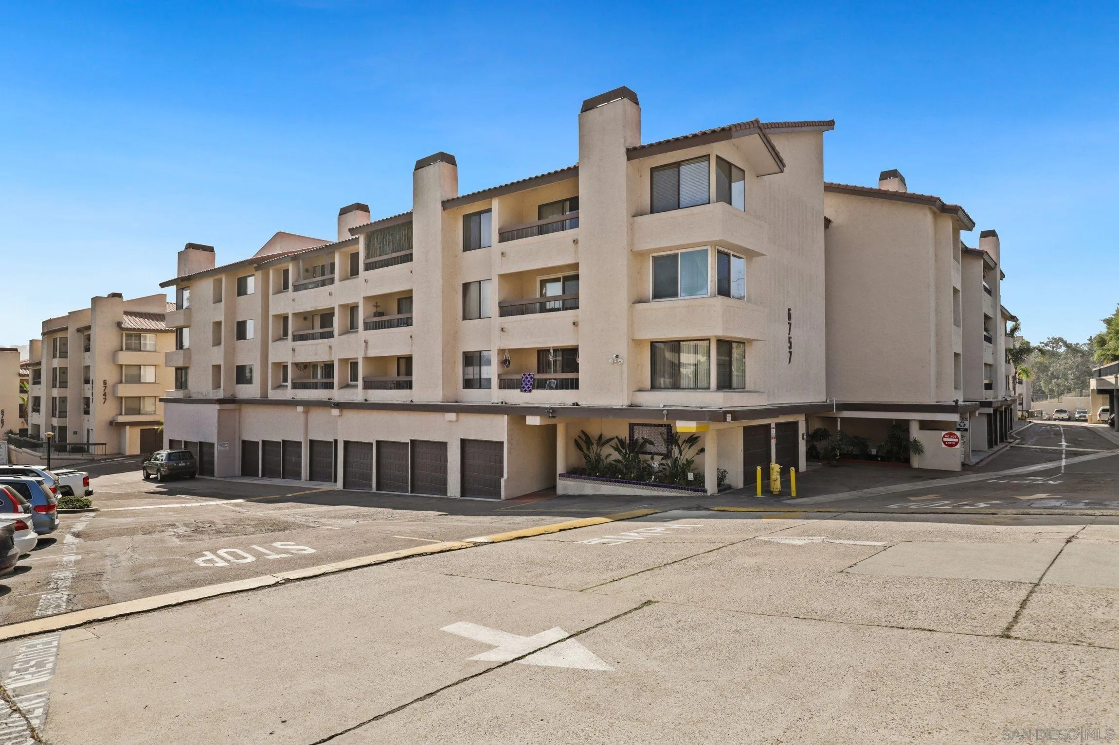 6757 Friars Road, Unit 13 San Diego, CA 92108 - Photo 1 of 15 a front view of a building with glass windows
